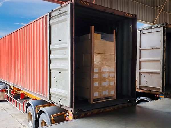 truck being loaded with pallets