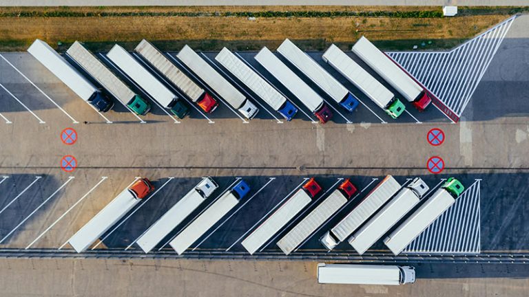 group of semi truck stopped at rest area